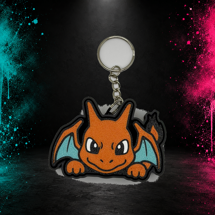 Large orange dragon clicker keychain with teal wings